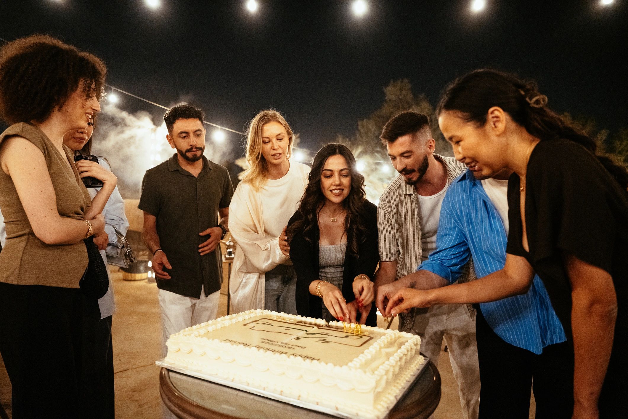 Group celebration photographed at a rooftop event
